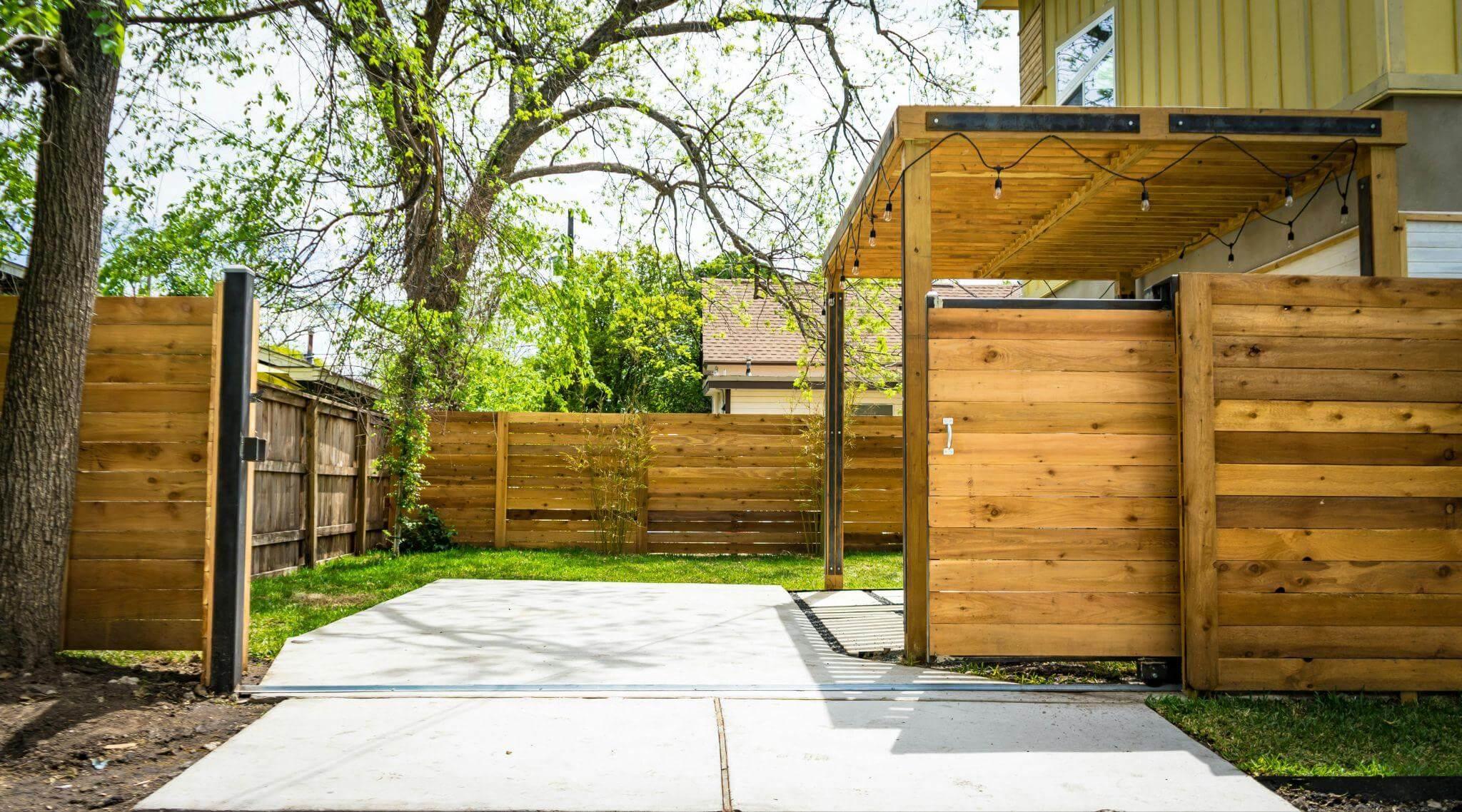 a wooden fence with a walkway leading to it